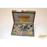 A box of various costume jewellery