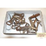 A box of various bottle openers