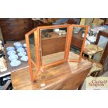 A teak framed triptych mirror