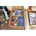 A box containing various model cars; games etc