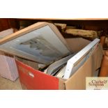 A box of various pictures and prints