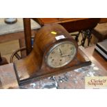 An oak cased three hole mantle clock