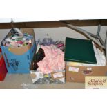 Three boxes of various textiles etc.