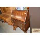 A mahogany serpentine fronted bureau fitted two dr