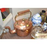 A brass and copper kettle