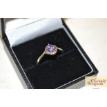 A boxed silver and amethyst set ring