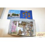 A box of various coinage and bank notes