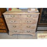 A 19th Century stripped pine chest of four long gr