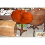 A 19th Century mahogany oval snap top tripod occas