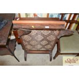 A 19th Century drop leaf tea table; and a fire screen embroider