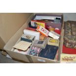 A box containing various cards and other games etc