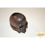 A Japanese wooden skull Netsuke