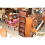 A reproduction mahogany bookcase of narrow proport