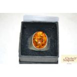 A silver and amber dress ring