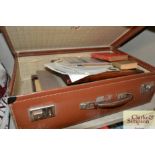 A suitcase of various photographs and ephemera