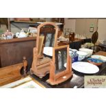 Two pine swing framed bathroom mirrors