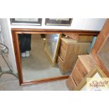 A large pine framed wall mirror