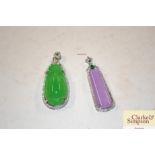 Two jade type pendants