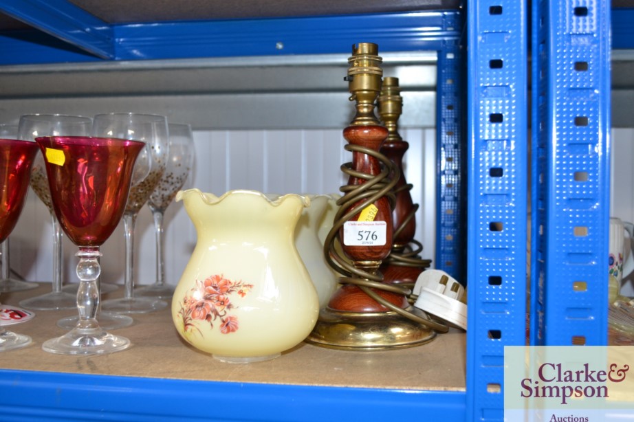 A pair of wooden and brass table lamps