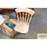 An elm seated stick back kitchen chair