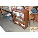 An oak book case and contents of various books