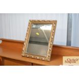 A gilt framed easel wall mirror