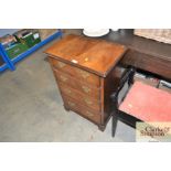 A mahogany chest fitted four long drawers