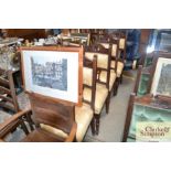 A set of four upholstered dining chairs