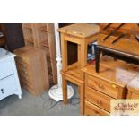 A pair of pine bedside tables