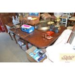 A 19th Century mahogany tea table raised on ring