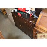 A stained pine sideboard fitted two drawers