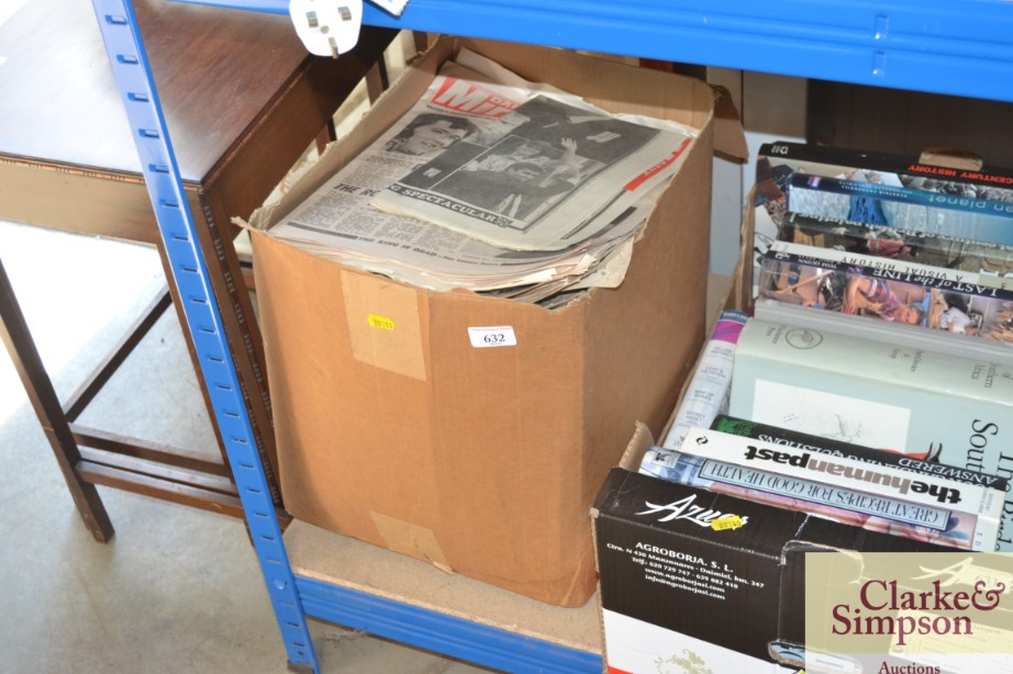 A box of miscellaneous commemorative newspapers