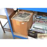 A box of miscellaneous commemorative newspapers