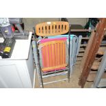 A quantity of folding chairs