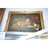 A still life picture on canvas in decorative gilt