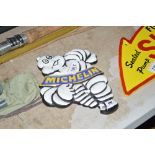 A reproduction Michelin Man plaque