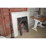 A cast iron fire back and fireplace