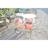 A galvanised wheel barrow and contents of various