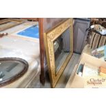 A large decorative gilt and painted framed wall mi