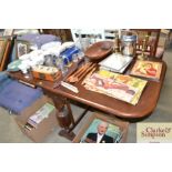 An oak drop leaf dining table