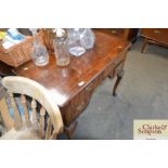 An antique walnut lowboy