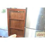 A shallow glazed wall display cabinet