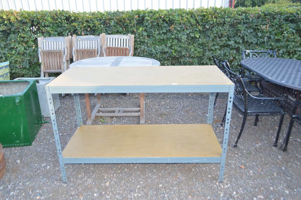 A two tier metal and wooden work bench