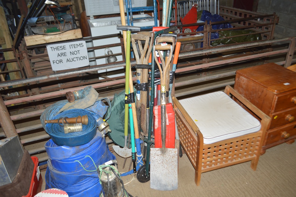 A large quantity of long handled gardening tools