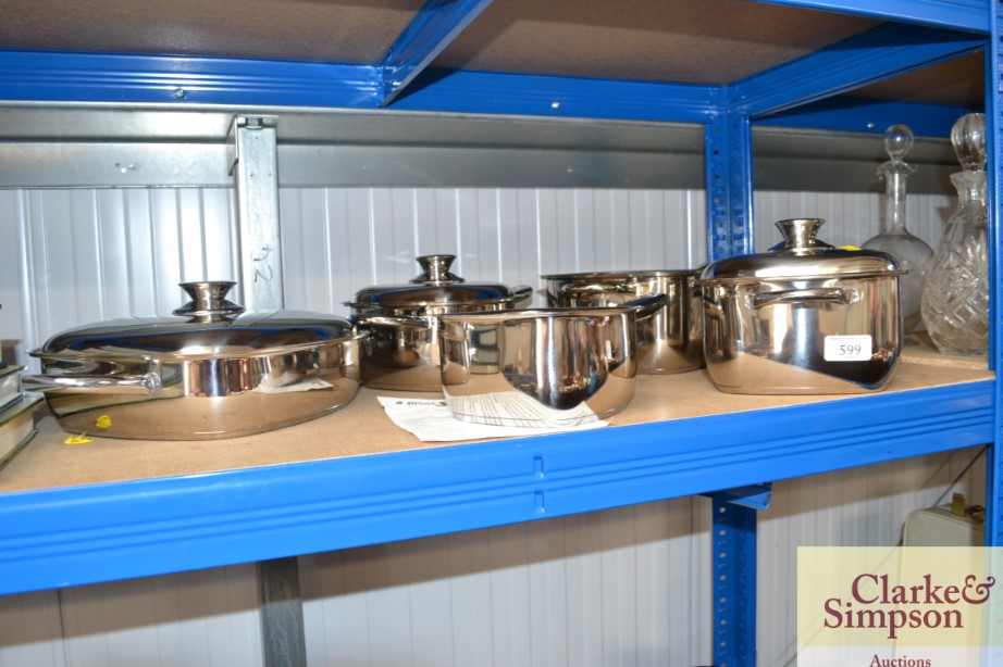 A set of five Judge saucepans, one missing a lid