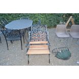 A pair of metal and teak garden armchairs