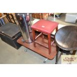 A retro table on casters together with a stool
