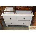 A white painted chest fitted two short over one lo