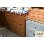 A teak chest fitted five long drawers