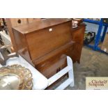 A teak bureau fitted single drawer, raised on cupb